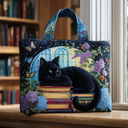 Bolso artesanal Chat Noir sobre libros