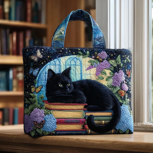 Bolso artesanal Chat Noir sobre libros