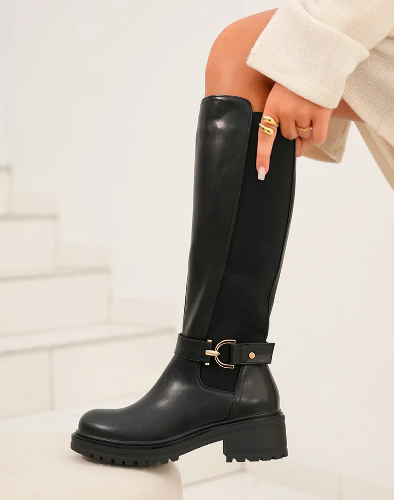 Botas altas negras con banda elástica y detalle dorado